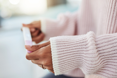 A woman waits for a pregnancy test after Oasis Fertility Clinic.